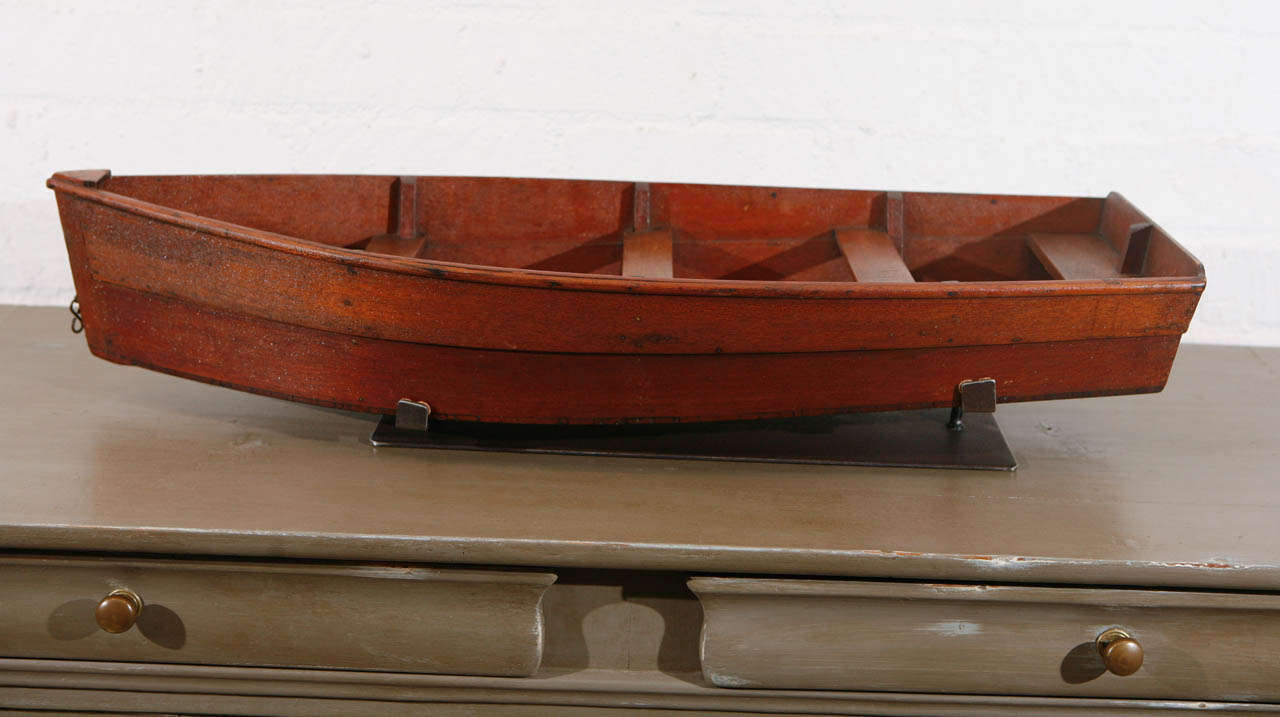 This model of a five seat rowboat is a wonderfully made piece of craftsmanship from the turn of the 20th century. The details of the construction and large size of this model indicates it might have been used as a boat makers sample. We have created