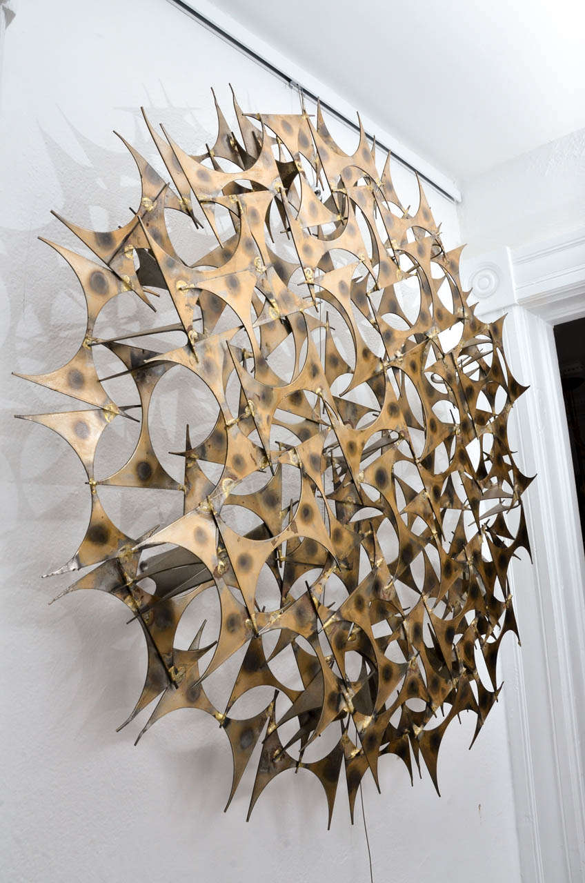 Marc Weinstein starburst wall sculpture.