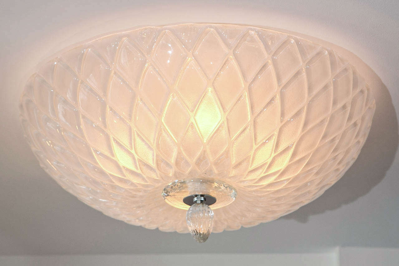 Murano textured blown glass in a shimmery opaque white tone finishing with large glass disk and 'toupie' finial

This opaque white fixture will be made install ready in nickeled hardware to match the nickel detail on the finial and electrified to