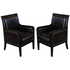 A Pair of Ebonized and Leather Upholstered Chairs 1