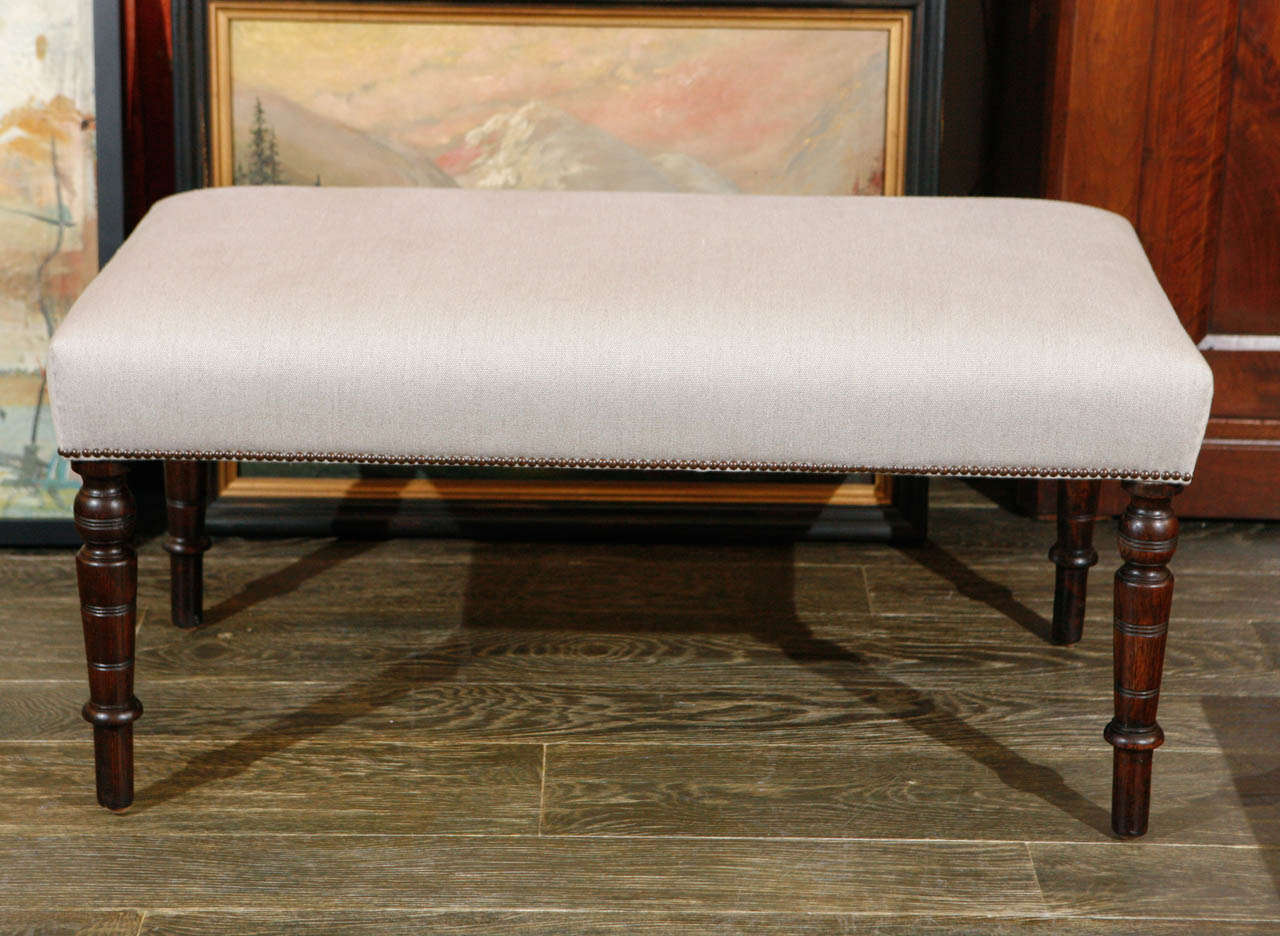 An upholstered bench.
