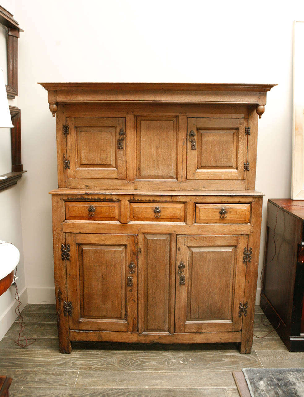 1800s English court oak cupboard. This handsome cupboard has four doors and three drawers. 