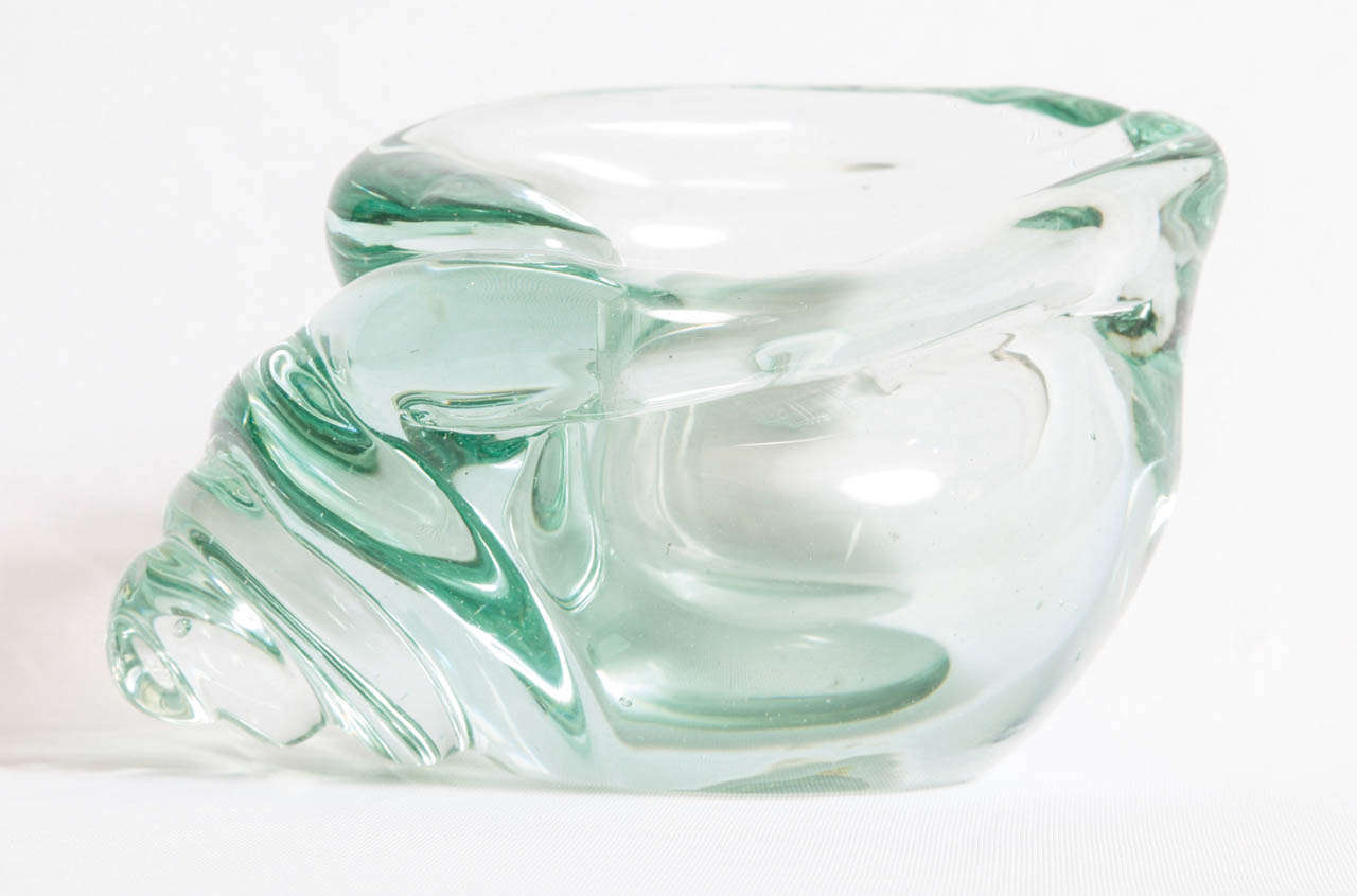 A rare 'Conchiglia' vase/bowl in 'Verde nord' glass (model number 6446) designed by Flavio Poli (1900-1984) and executed by Seguso Vetri D'Arte, a glasswoorks in Murano, Italy.
