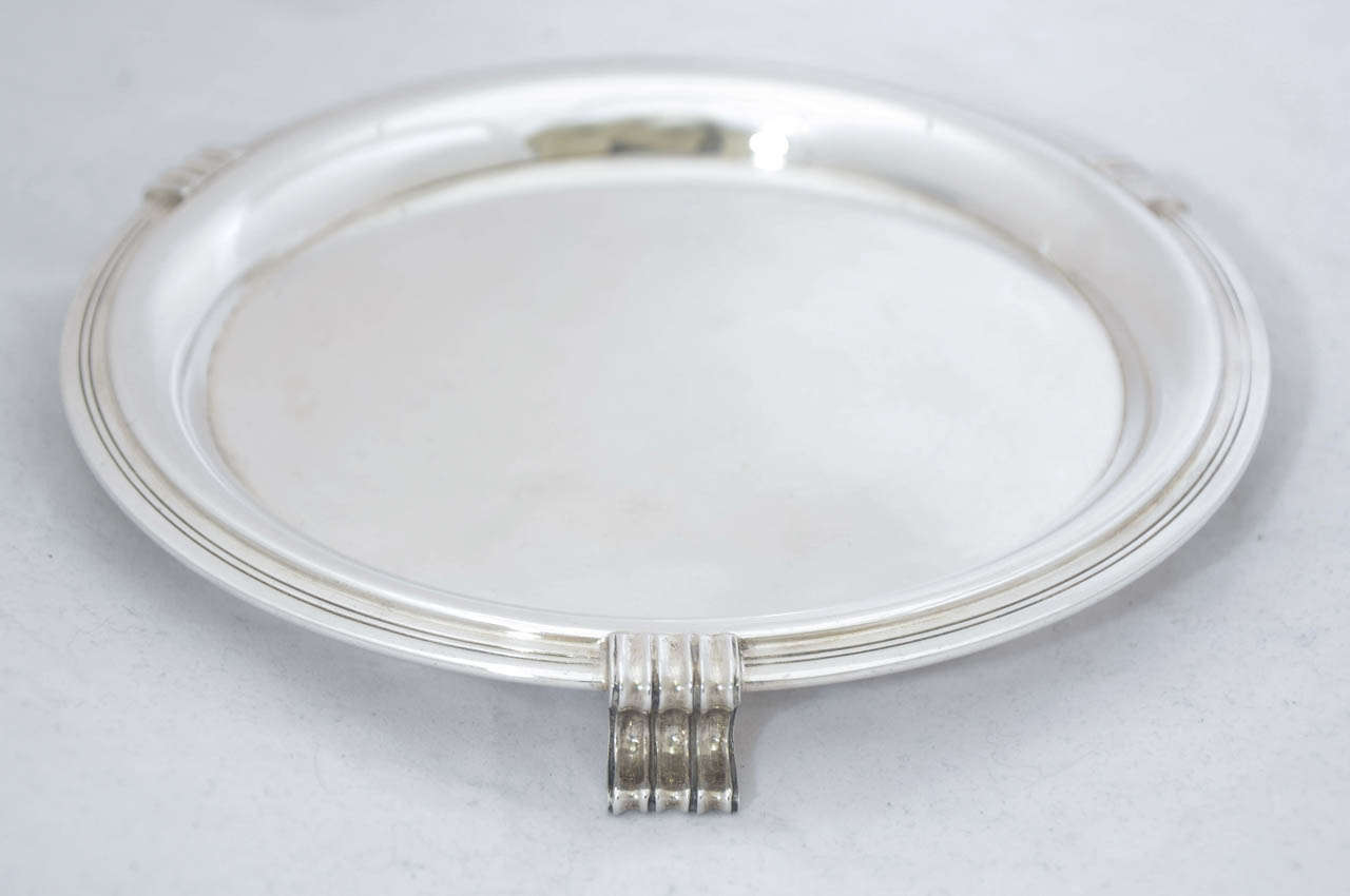 A Pair of Art Deco sterling silver trays or salvers, made by the British firm of Mappin & Webb in the city of Sheffield in 1936.
The diameter of each salver is 17 cms and their total weight is 400 gms.