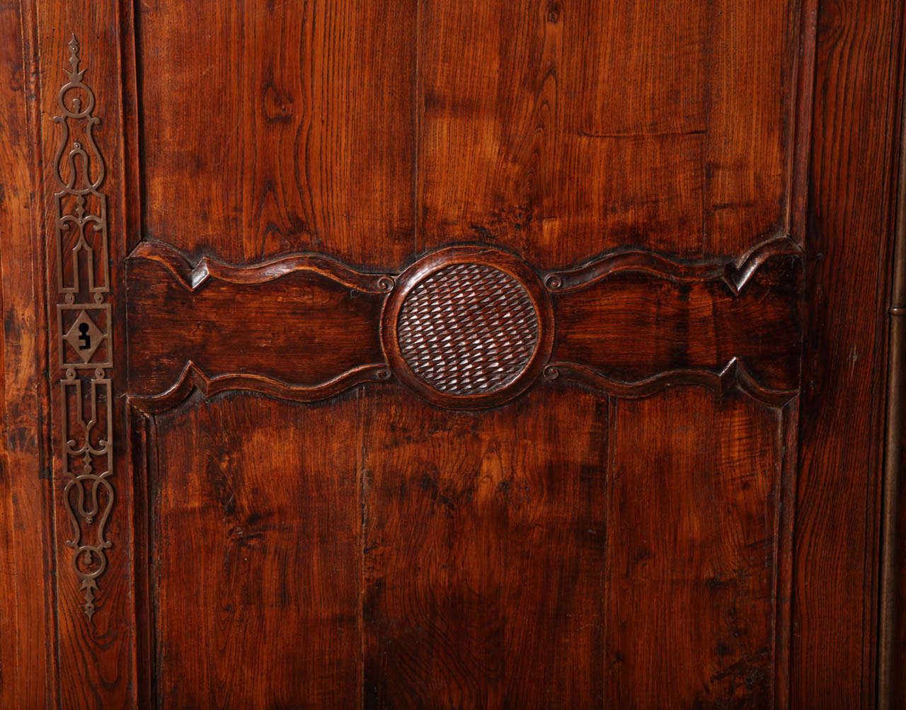 A Louis XV Style Carved and Stained Walnut Single Door Armoire In Excellent Condition In New York, NY