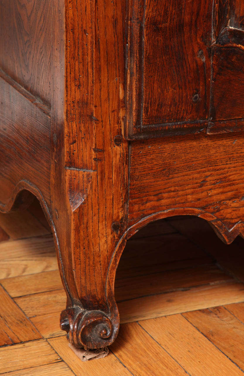 A Louis XV Style Carved and Stained Walnut Single Door Armoire 1