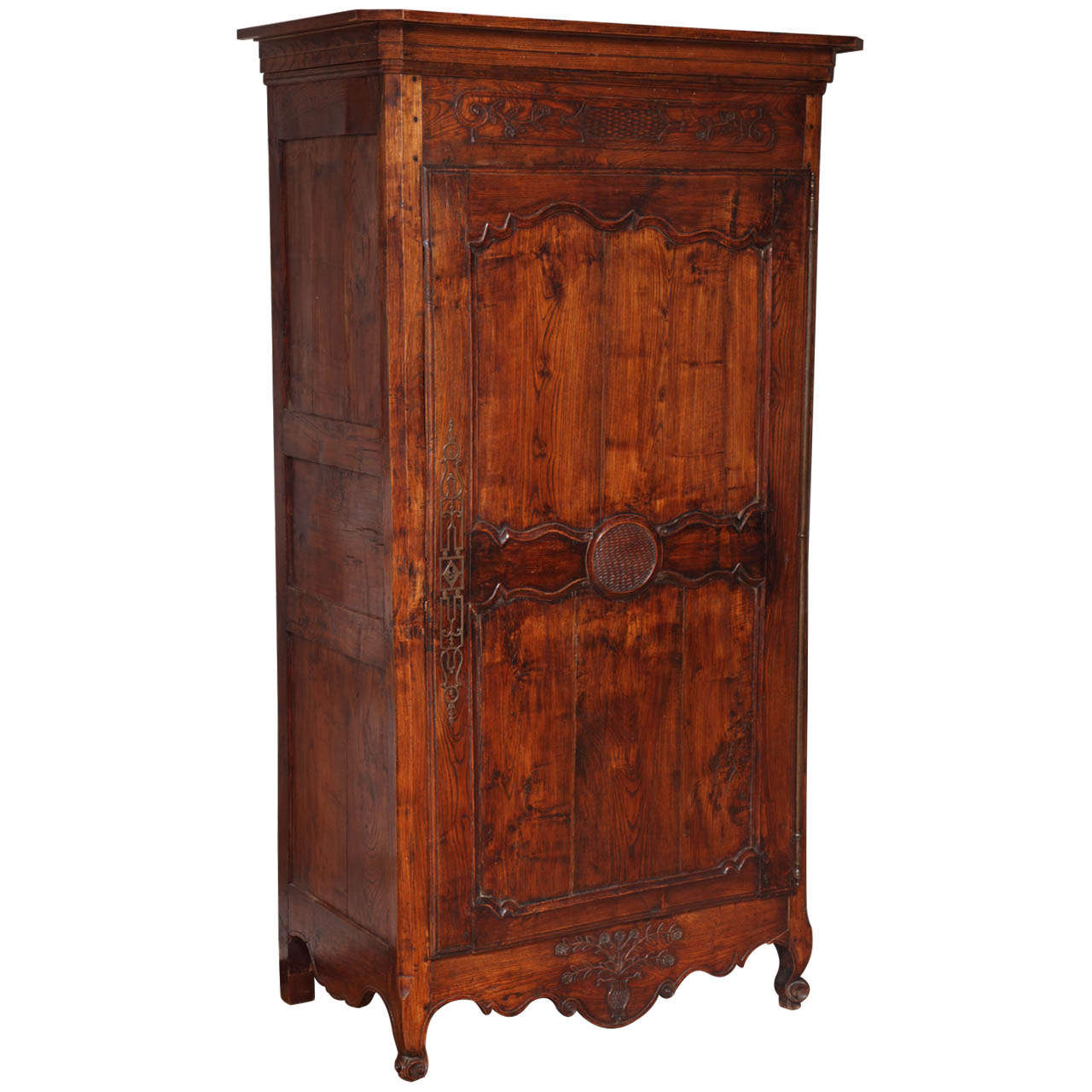 A Louis XV Style Carved and Stained Walnut Single Door Armoire