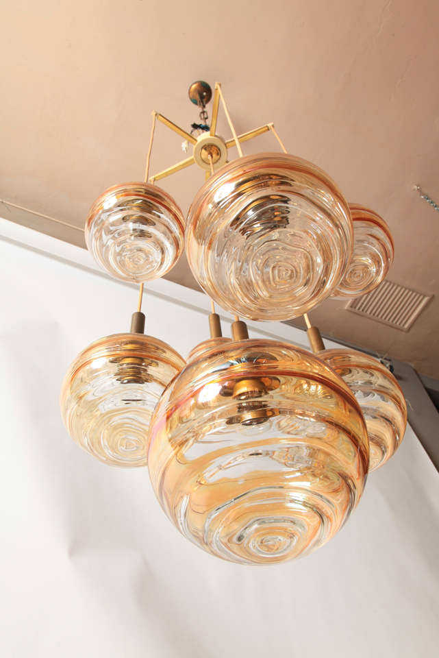 1970's 6 light iridescent glass globes in 3 different sizes.