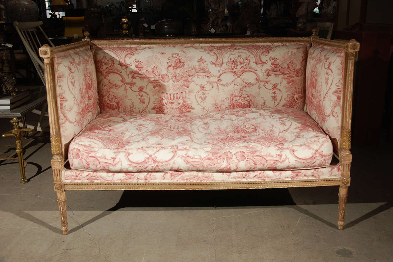 French LXVI painted and parcel gilt wood settee in toile printed fabric