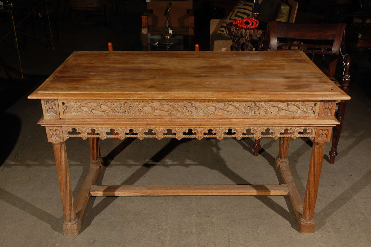 A Gothic style oak library table with one drawer