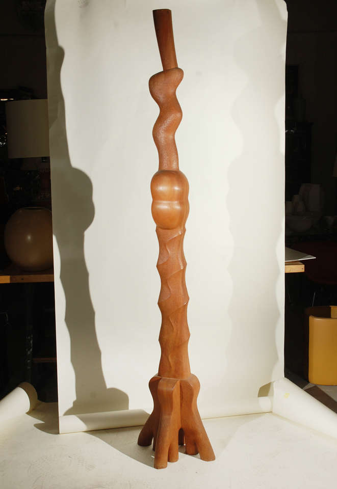 tall wood carved 'totem' like sculpture