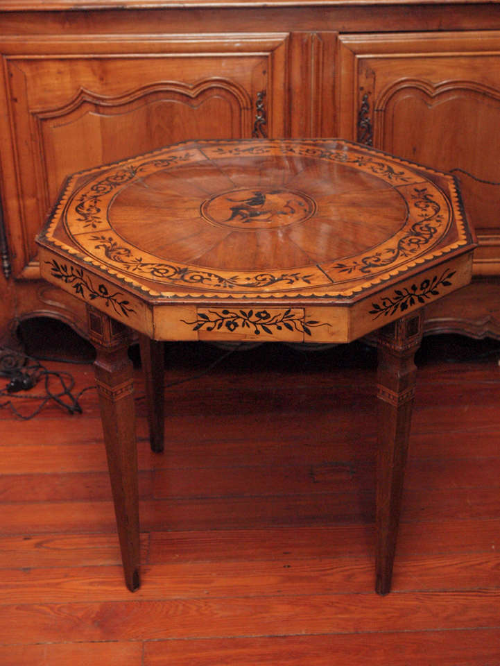 Italian fruitwood table with marquetry inlay of exceptional quality.