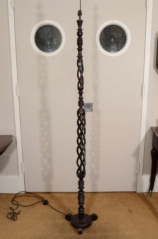 A Portuguese Carved and Turned Ebony and Ivory Floor Lamp