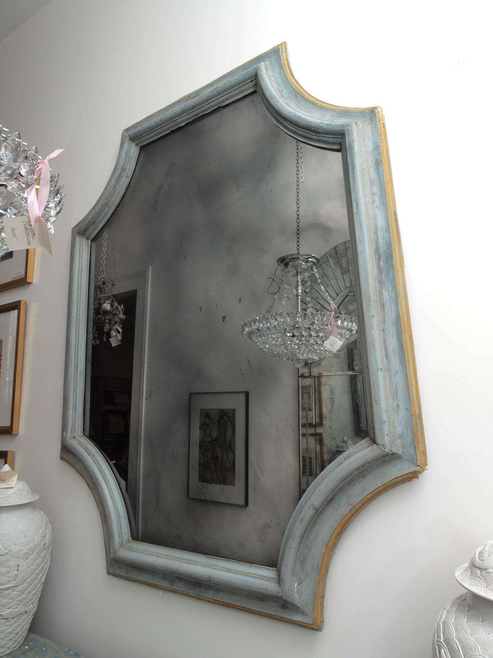 Pair of large 19th century French mirrors. The curving octagon shaped wood frame is painted French blue with contrasting border and surrounds a smoked glass mirror.