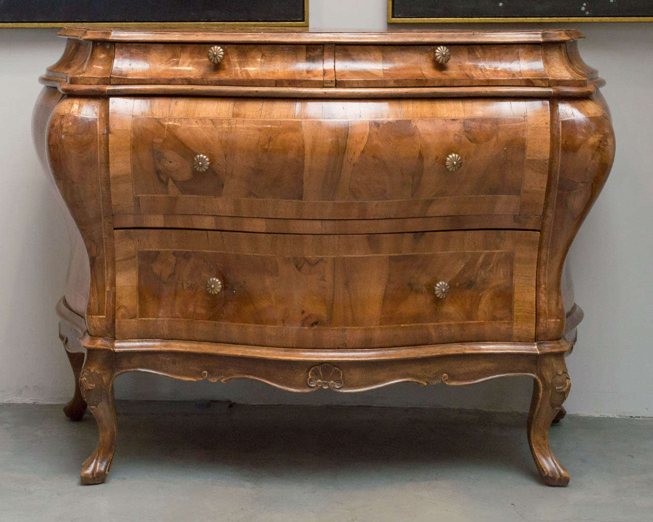 Late 19th century Italian Yew wood carved and set in random matched yew wood Bombay, burled. Rococo inspired Commode with shaped top and four drawers raised on cabriole legs with scrolling apron.