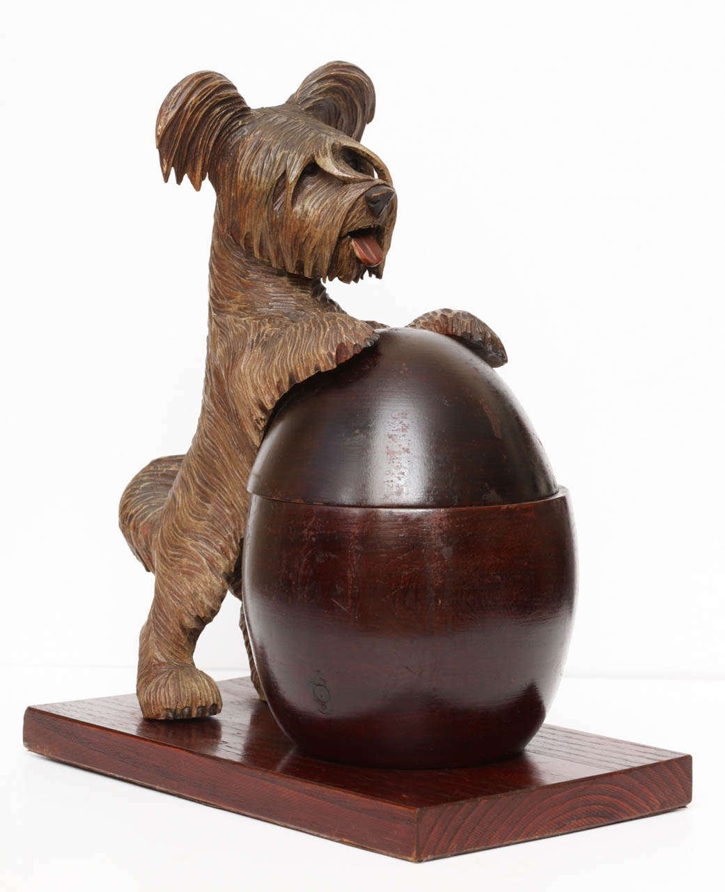 A novelty Black Forest  hand-carved Terrier box. A very beautifully executed piece with exceptional detail. The dogs hind legs are attached to the base with a spring like mechanism so when you pull him back the lid opens. Bears are the most commonly