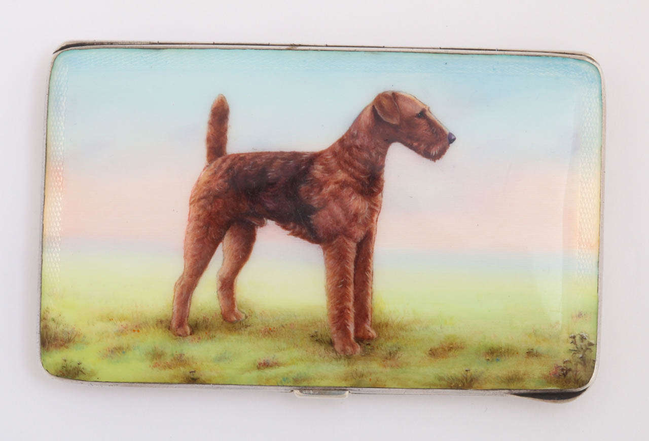 Sterling silver card case with a hand painted image of an Airedale Terrier. Impeccably done, the painting is extremely detailed and of very high quality. The enamel is in wonderful condition, no chips or imperfections. The backside of the sterling
