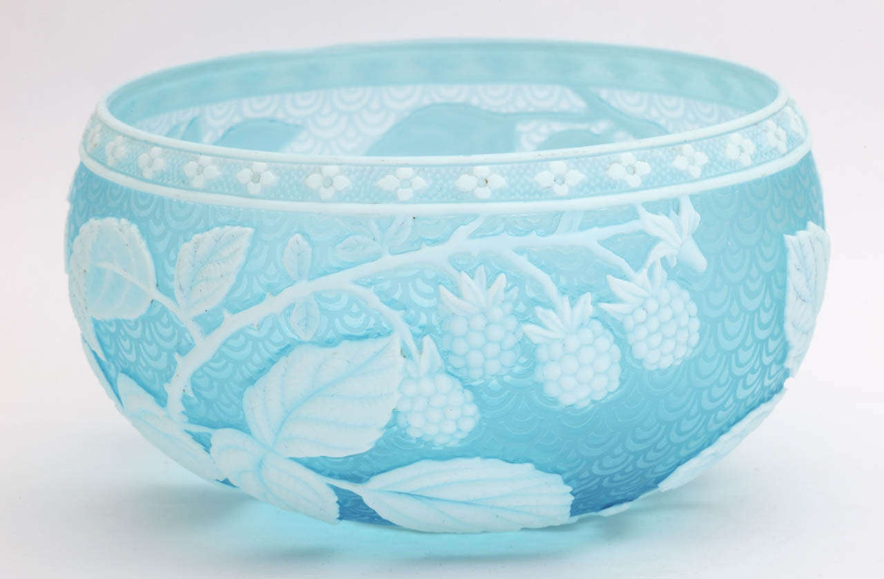 A rare unsigned Thomas Webb & Sons blue and white cameo glass bowl carved with fruit and leaves, acid carved background