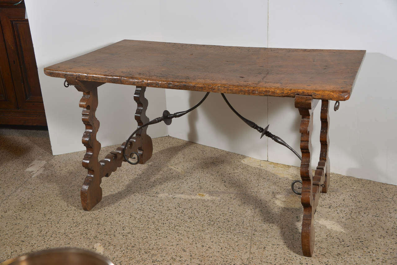 Beautiful Spanish table in walnut. Original hardware on each end, probably used for extensions.
