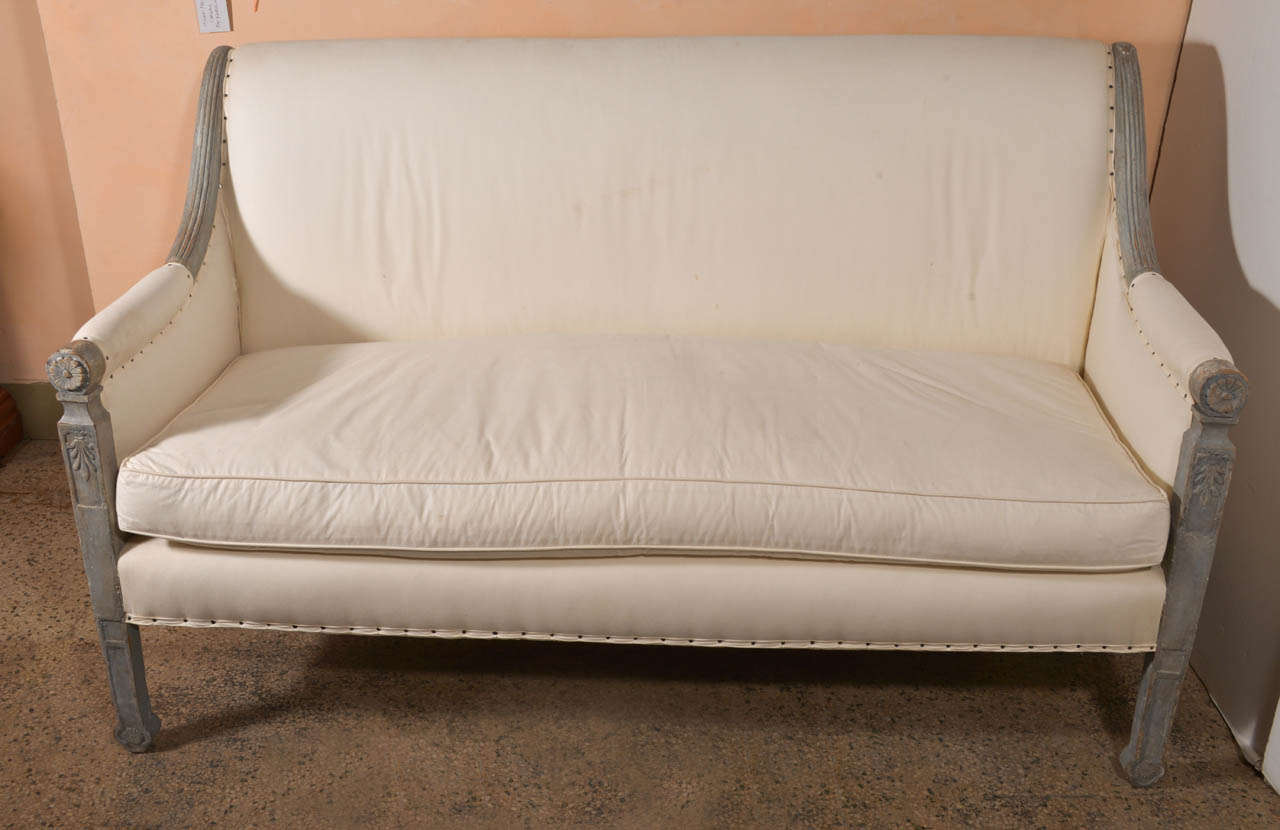 Painted and scraped Directoire style settee. Upholstered in muslin with new down cushion.