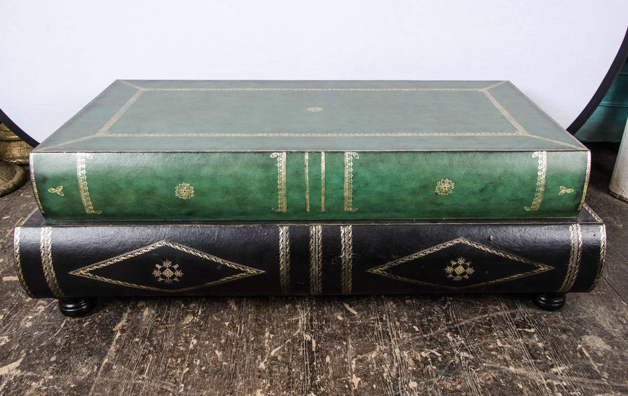 French leather coffee table in the shape of books ,body is in the form of 2 large leather bound books with two drawers