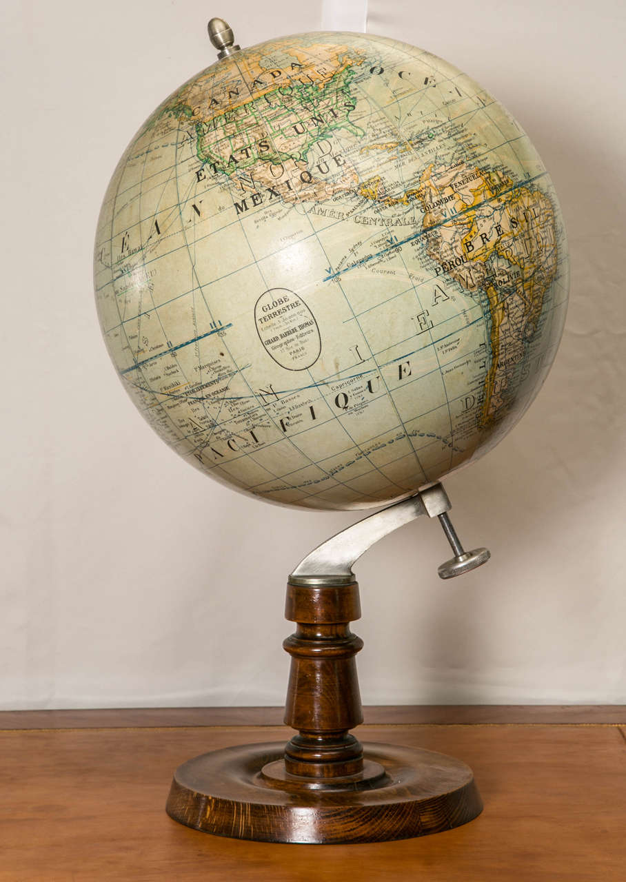 Terrestrial globe in papier mâché.
Signed Girard, Barrere and Thomas.
19, Rue de Buci Paris.
Early 20th century 
Walnut stand.
Perfect condition.