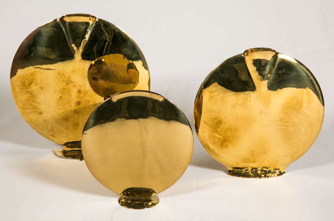 Three vases in brass.
Signed geerges-Henri Perrichaud
France 1980
They give a touch of  opulence.