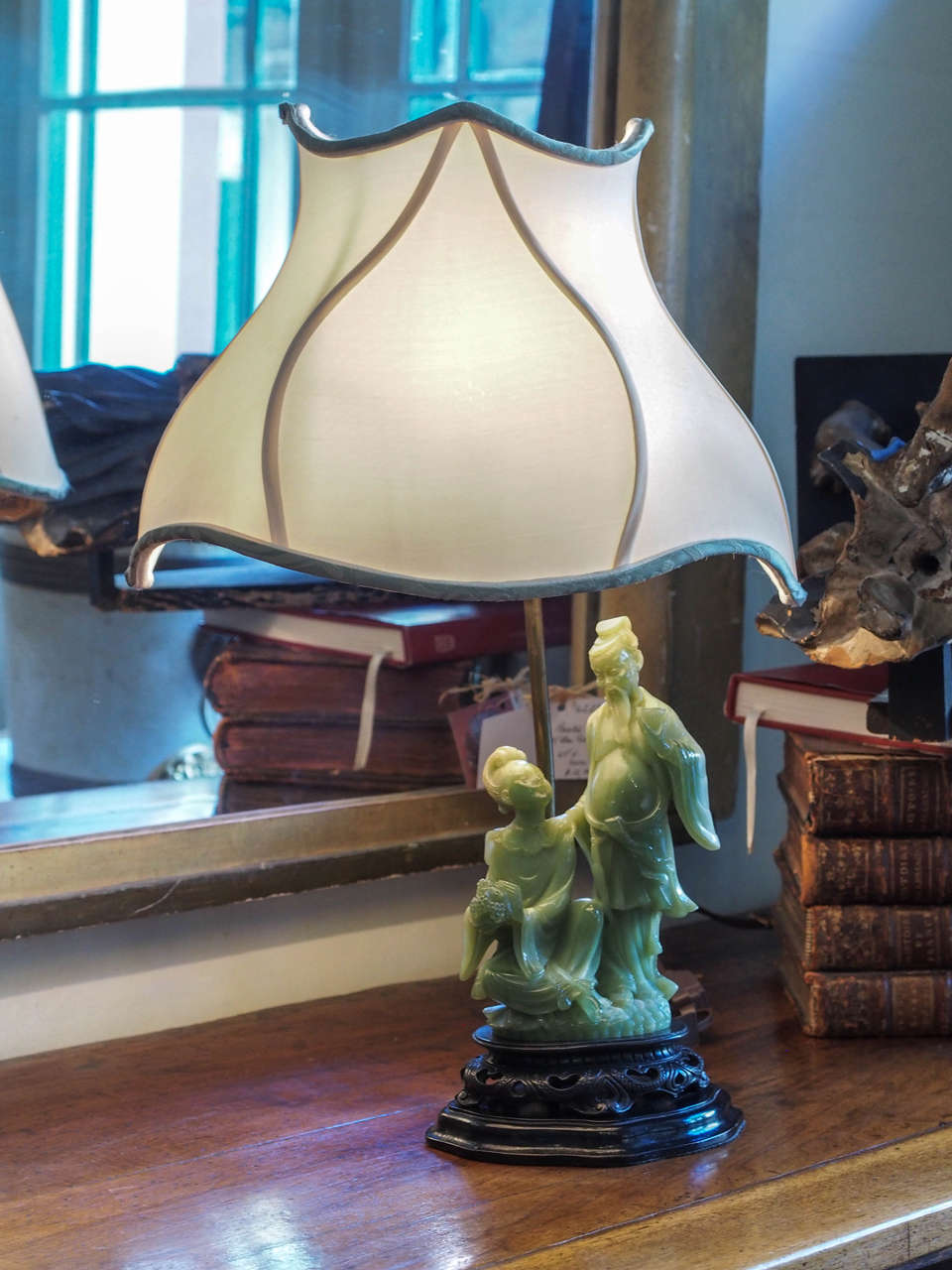 This exquisite lamp is made of 19th century carved Chinese jade, circa 1880 on a carved rosewood base.