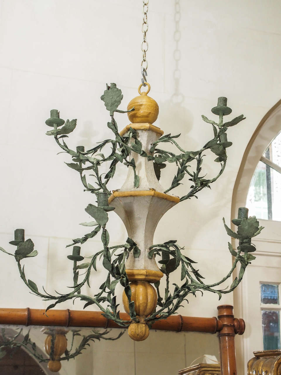 These late 18th century twelve-light l'orangerie chandeliers from the south of France have been meticulously restored. The stems and leaves are tole; it is not electrified.