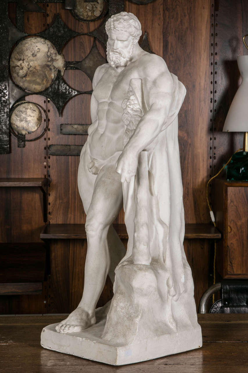 Tall and beautiful early 20th century French reproduction in plaster, of the famous statue from the Farnese collection. The original antique piece is shown in Naples's museum in Italy.
He is represented in his famous attitude leaning on his knobby