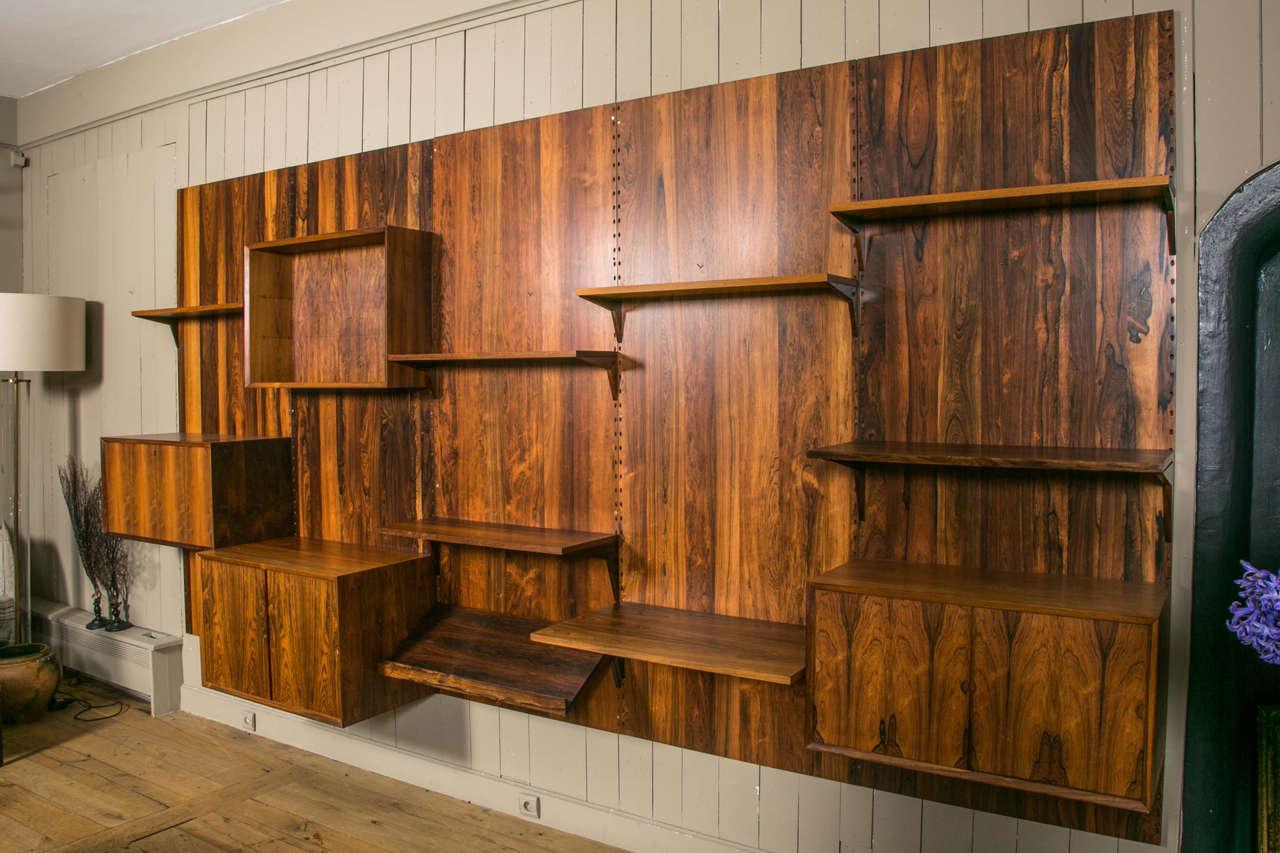 Vintage Danish modular wall unit designed by Poul Cadovius for Cado and fully refinished by Stéphane Olivier, to have a beautiful color.
Composed of five separate wall panels on which units and shelves can be arranged to suit the needs of any