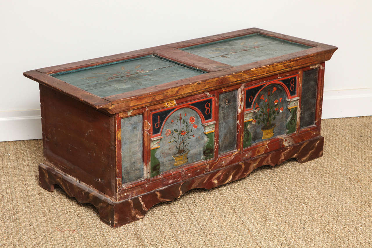 Fine early 19th century Norwegian Folk Art marriage coffer, the two panel top with floral decoration on powder blue ground framed by faux marble rails and stiles, the arcaded front with flowering urns surrounded by balustrade pilasters, dated 1808,