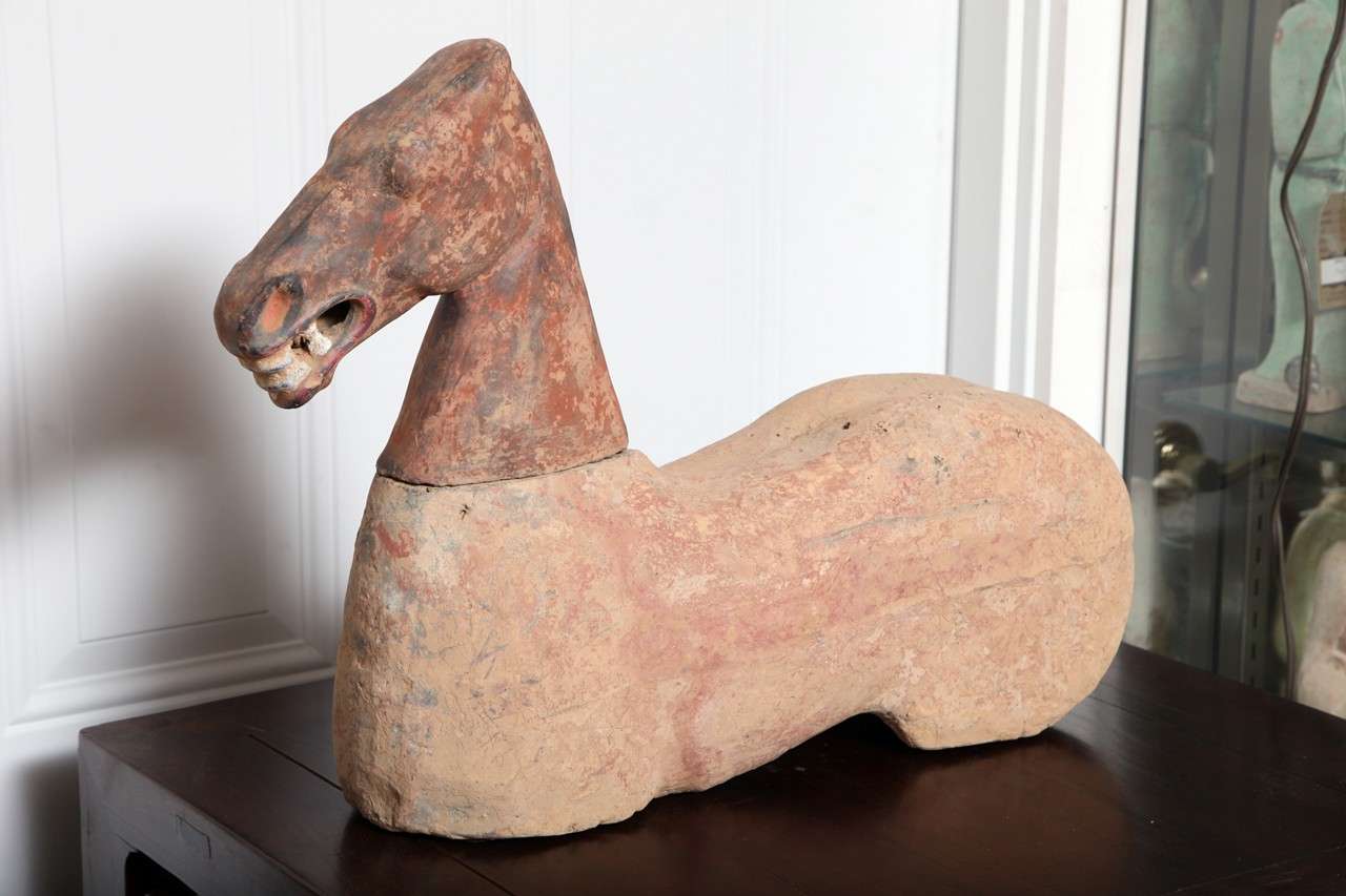 Imposing authentic excavated terracotta horse ( head is removable ).
Han Dynasty ( 200 B.C. - 200 A.D. ). Original pigments remaining. We unconditionally certify the authenticity of all our antiquities.