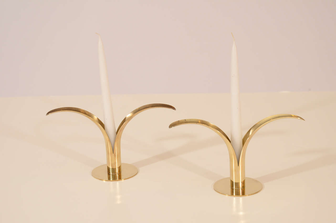 Lovely and graceful Classic brass candlesticks designed by Ivar Alenius-Bjork for Ystad Metall of Sweden. These are polished but not lacquered and have a subtle, attractive patina. Please contact for location. Offered by Las Venus by Kenneth Clark,