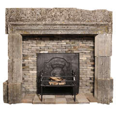 Antique 18th century fireplace of limestone moulding