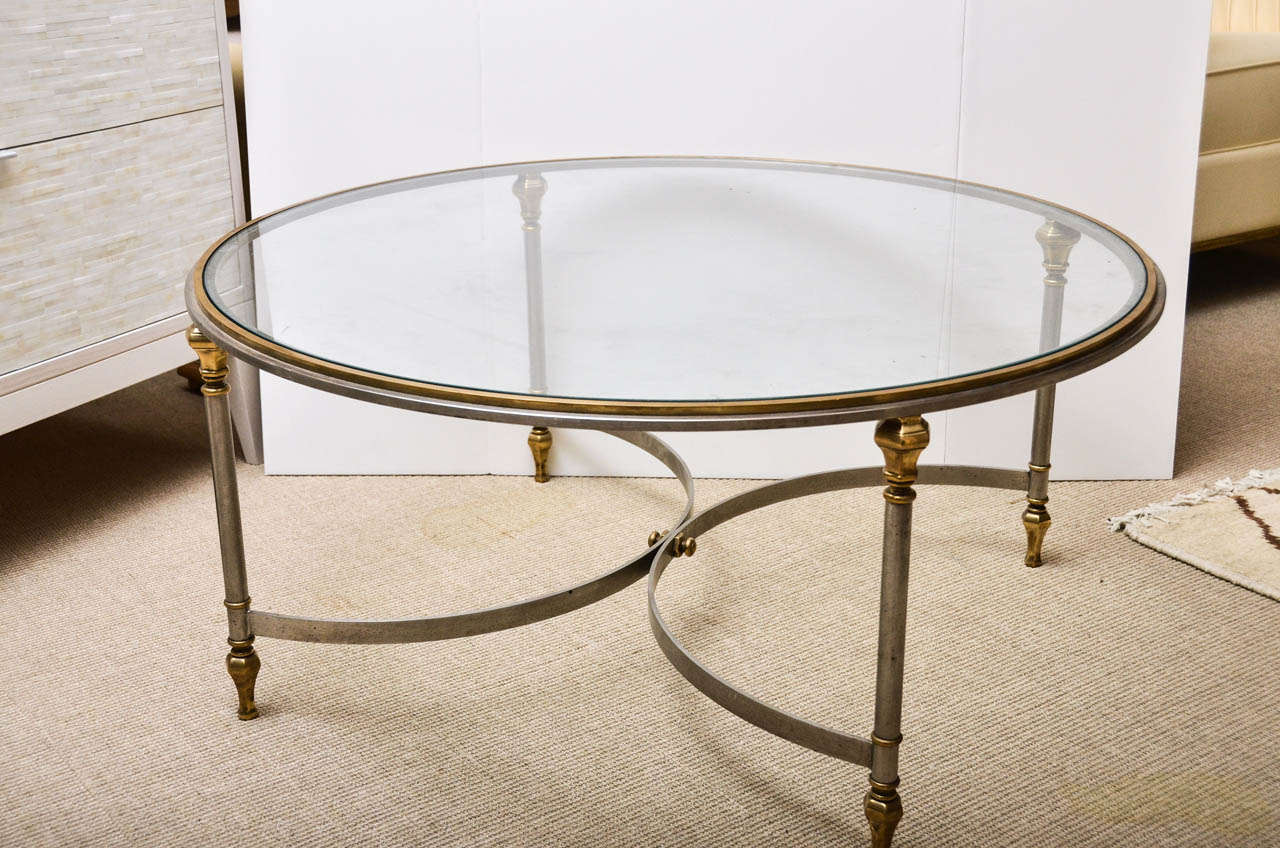 Round steel, brass and glass cocktail table attributed to Maison Jansen