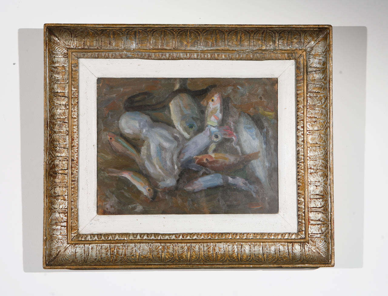 Still life painting of sea life, i.e., fish, octopus, squid, eel, etc., in oil on artist's board, covered in glass in a carved wood frame of distressed silver leaf. Actual image size 10
