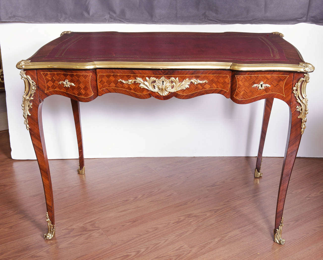 19th c Rosewood and Kingwood French Louis XV writing desk. Leather top surface