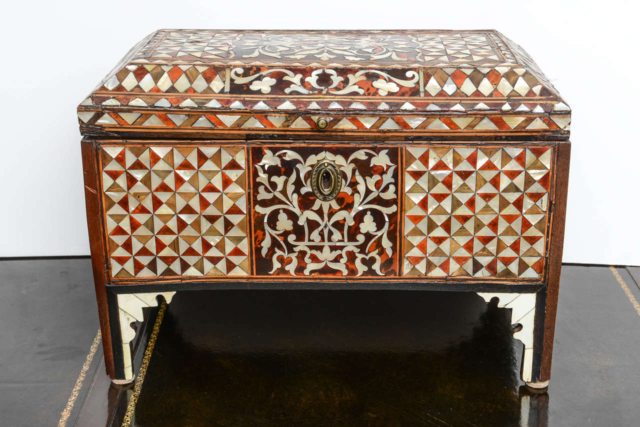 A 18th century Turkish mother-of-pearl inlaid chest inlaid throughout to show foliate scrolls and geometric forms, raised on four legs.
 From the 16th century onwards the dominant influences in Islamic woodwork were those of the Ottoman Turkish