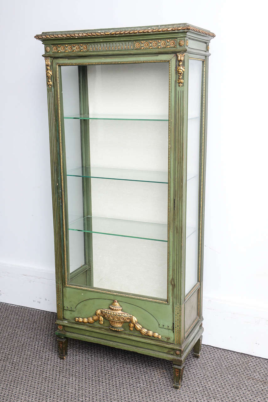 This is a very nice hand painted display cabinet with the original paintwork and gilt wood.It sit on square tapered legs and they are tree glass shelves to the inside....H70 W42 D21. There is a tear on the fabric inside and its pretty old fabric it