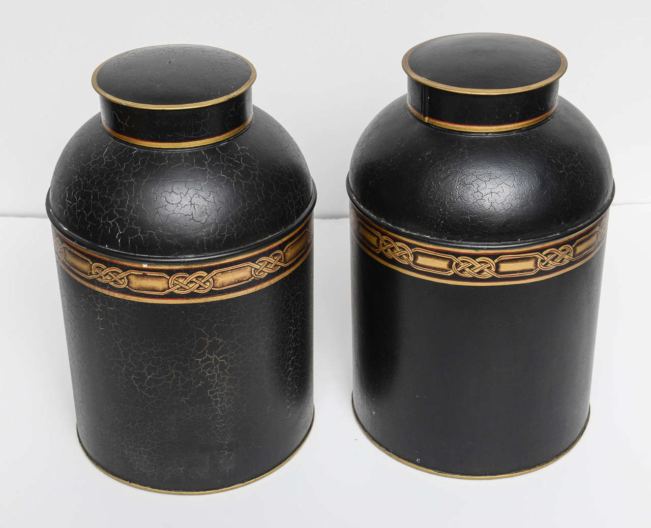 Wonderful pair of high quality canisters with a mottled black/ charcoal finish & burnished gold details.  Ideal for display & great lamp bases.  I was told they were manufactured in England by the very well know Vaughan Company which distributes in