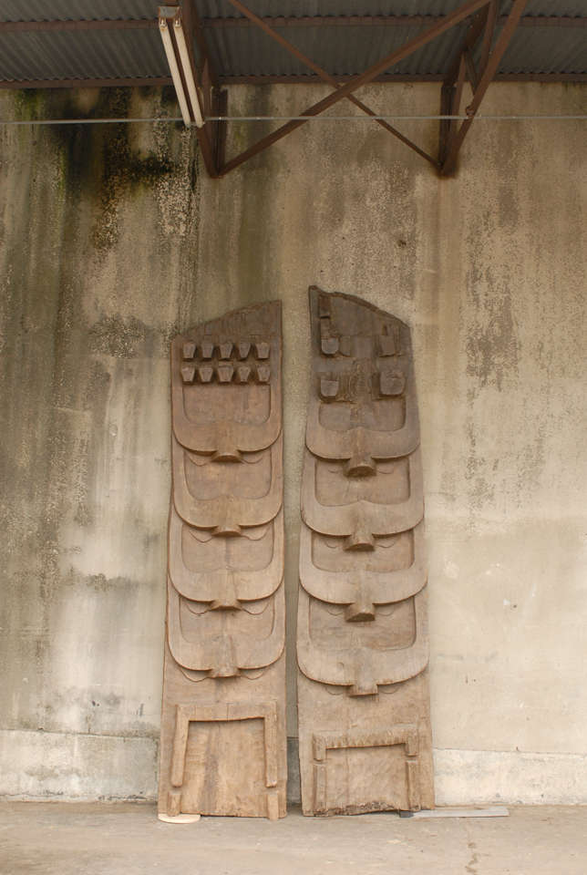 Two large size Indian wooden carvings from the early 20th century. These carved architectural pieces were situated on the facade of important Naga structures, in the Northern part of India. They were carved from a single large tree and depict the