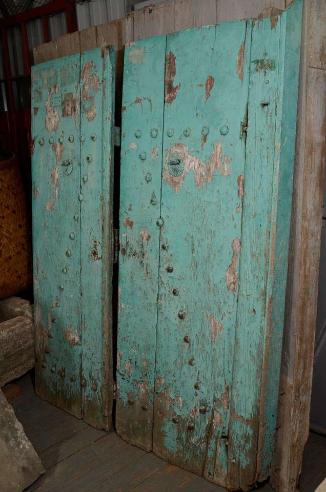 Blue painted wood barn doors with original metal hardware