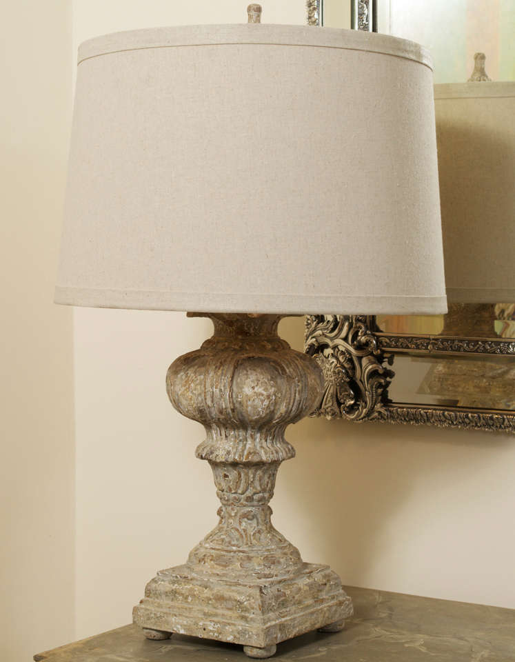 A carved wood lamp