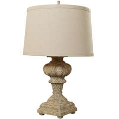 A carved wood lamp