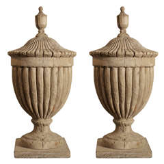 A pair of wood urns
