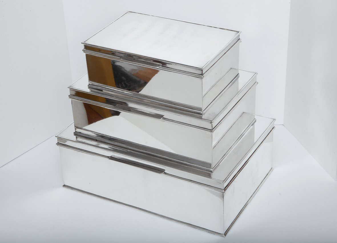 Foundwell has designed and commissioned this set of three handmade Art Deco inspired oversized cigar boxes.  Made by a  silversmith in England employing classic techniques,  the boxes come in three graduated sizes. (Measurements below).  Featuring