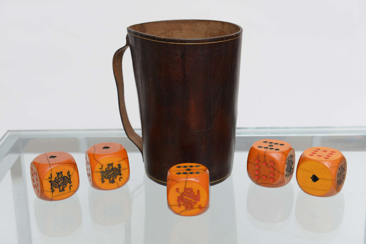 Italian Poker Dice set with 5 Bakelite Dice and Leather Cup.
Dice Measures at 1.88 Inches Cubed.
Cup Measures at H 7.5