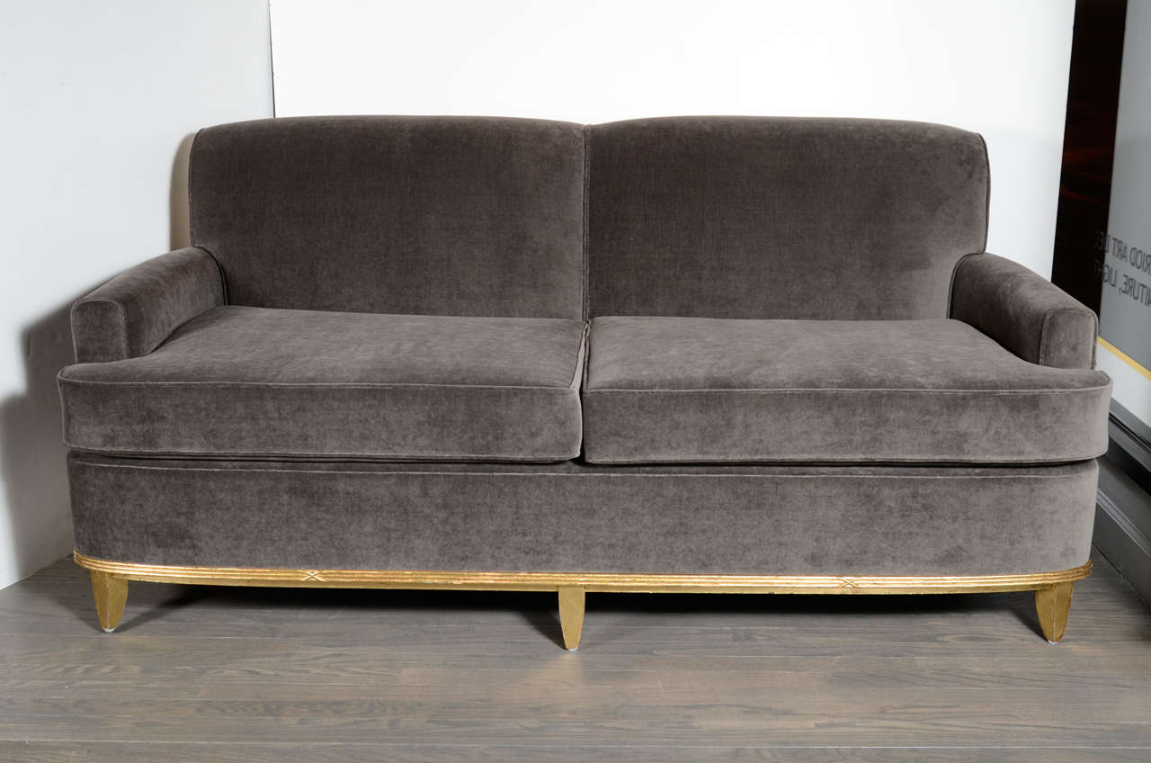 Classic sofa newly upholstered in gorgeous grey mohair. Tapered legs and a gilt ribbed detail. Has a matching chair and ottoman that is sold separately.