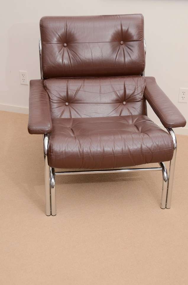 Pieff was one of the most important manufacturers of high end British furniture during the 60's and 70's - designed primarily for Harrods and Heals. Two loose back cushions and one loose seat cushion. All buttoned in soft brown leather in a